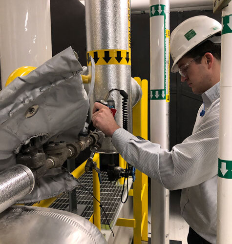 Technician performing a steam trap survey